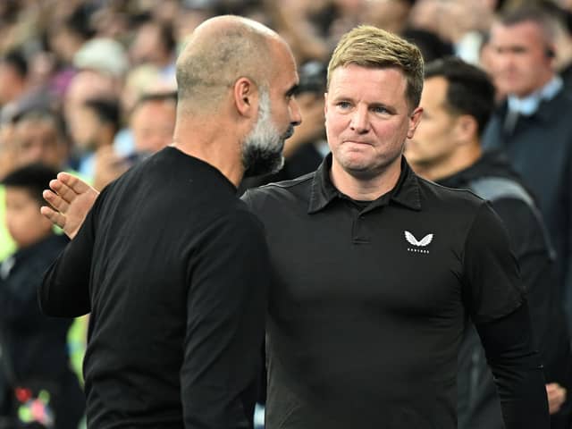 MANCHESTER, ENGLAND - AUGUST 19: Eddie Howe, Manager of Newcastle United, interacts with Pep Guardiola, Manager of Manchester City, prior to the Premier League match between Manchester City and Newcastle United at Etihad Stadium on August 19, 2023 in Manchester, England. (Photo by Michael Regan/Getty Images)