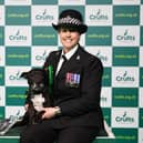 PC Claire Todd with Stella, a Staffordshire Bull Terrier who won Hero Dog of the Year today (Sunday 12.03.23), the last day of Crufts 2023, at the NEC Birmingham. (BeatMedia)