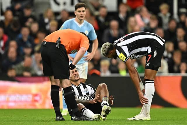 Bruno Guimaraes was feeling his ankle during the match.  