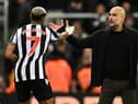 Manchester City’s Spanish manager Pep Guardiola (R) congratulates Newcastle United’s Brazilian striker #07 Joelinton after the English League Cup third round football match between Newcastle United and Manchester City at St James’ Park in Newcastle-upon-Tyne, north east England on September 27, 2023. Newcastle won the match 1-0. (Photo by Oli SCARFF / AFP) /
