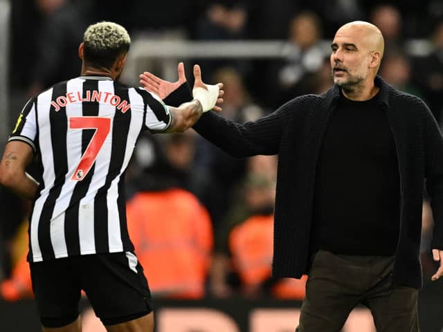 Manchester City’s Spanish manager Pep Guardiola (R) congratulates Newcastle United’s Brazilian striker #07 Joelinton after the English League Cup third round football match between Newcastle United and Manchester City at St James’ Park in Newcastle-upon-Tyne, north east England on September 27, 2023. Newcastle won the match 1-0. (Photo by Oli SCARFF / AFP) /