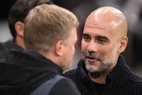 Manchester City boss Pep Guardiola speaking to Eddie Howe.  (Photo by Stu Forster/Getty Images)