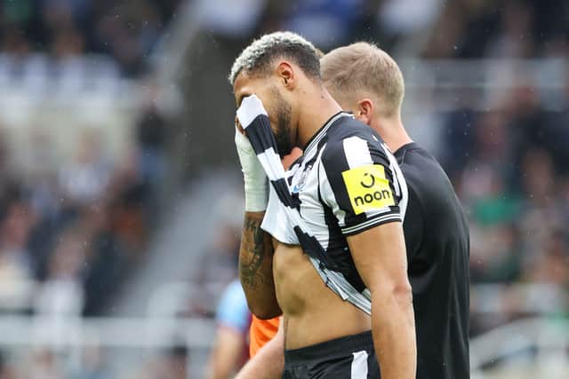 Joelinton of Newcastle United leaves the pitch after an injury during the Premier League match between Newcastle United and Burnley FC at St. James Park on September 30, 2023 in Newcastle upon Tyne, England.