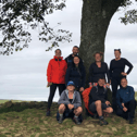 Back left to right:  Alison Wilson, Simon Tate, Angie Comerford, Kirsty Robson, and Stephanie McDowell. Front left to right: Emma Butler, Steph Comerford and Paul Rogers under the Sycamore Gap tree.