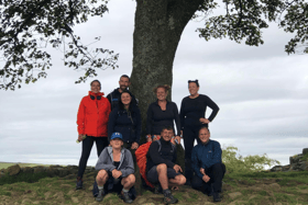 Back left to right:  Alison Wilson, Simon Tate, Angie Comerford, Kirsty Robson, and Stephanie McDowell. Front left to right: Emma Butler, Steph Comerford and Paul Rogers under the Sycamore Gap tree.