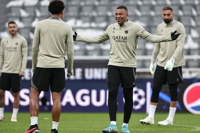 Paris Saint-Germain's French forward #07 Kylian Mbappe (2R) talks with Paris Saint-Germain's Brazilian defender #05 Marquinhos (2L) during a team training session at St James's Park stadium in Newcastle-upon-Tyne, north east England on October 3, 2023, on the eve of their UEFA Champions League group F football match against Newcastle United. (Photo by FRANCK FIFE / AFP) (Photo by FRANCK FIFE/AFP via Getty Images)