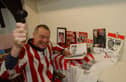 John Kirton from Boldon Auction Gallery got right into the spirit of this 2004 auction.
All the items were memorabilia to do with SAFC.