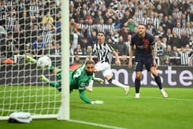 Miguel Almiron of Newcastle United scores the team's first goal during the UEFA Champions League match between Newcastle United FC and Paris Saint-Germain at St. James Park on October 04, 2023 in Newcastle upon Tyne, England. (Photo by Michael Regan/Getty Images)