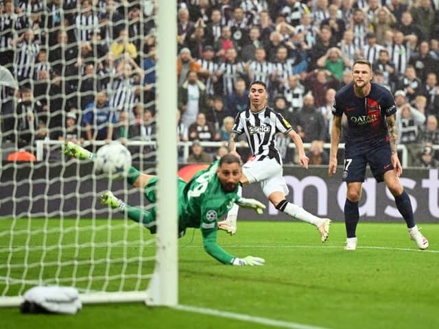 Miguel Almiron of Newcastle United scores the team's first goal during the UEFA Champions League match between Newcastle United FC and Paris Saint-Germain at St. James Park on October 04, 2023 in Newcastle upon Tyne, England. (Photo by Michael Regan/Getty Images)