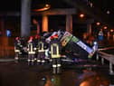 Firefighters work on the site of a bus accident on 3 October in Mestre, near Venice (Photo: MARCO SABADIN/AFP via Getty Images)