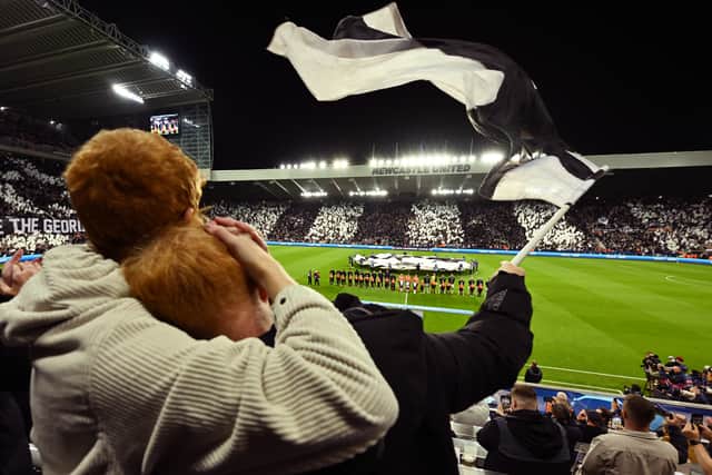  Fans of Newcastle United look on as they wave a flag prior to the UEFA Champions League match between Newcastle United FC and Paris Saint-Germain at St. James Park on October 04, 2023 in Newcastle upon Tyne, England. (Photo by Michael Regan/Getty Images)