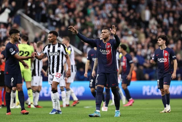 Paris Saint-Germain's French forward #07 Kylian Mbappe (C) applauds the fans after the UEFA Champions League Group F football match between Newcastle United and Paris Saint-Germain at St James' Park in Newcastle-upon-Tyne, north east England on October 4, 2023. Newcastle won the match 4-1. (Photo by FRANCK FIFE / AFP) / RESTRICTED TO EDITORIAL USE. No use with unauthorized audio, video, data, fixture lists, club/league logos or 'live' services. Online in-match use limited to 120 images. An additional 40 images may be used in extra time. No video emulation. Social media in-match use limited to 120 images. An additional 40 images may be used in extra time. No use in betting publications, games or single club/league/player publications. /  (Photo by FRANCK FIFE/AFP via Getty Images)