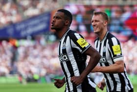 Alexander Isak of Newcastle United celebrates after scoring their sides first goal during the Premier League match between West Ham United and Newcastle United at London Stadium on October 08, 2023 in London, England.