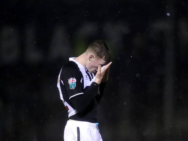 Elliot Anderson of Newcastle United reacts following defeat in the Papa John’s EFL Trophy Group match between Harrogate Town and Newcastle United U21’s at The EnviroVent Stadium on October 05, 2021 in Harrogate, England. (Photo by George Wood/Getty Images)