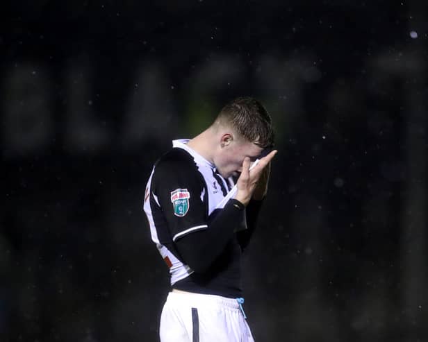 Elliot Anderson of Newcastle United reacts following defeat in the Papa John’s EFL Trophy Group match between Harrogate Town and Newcastle United U21’s at The EnviroVent Stadium on October 05, 2021 in Harrogate, England. (Photo by George Wood/Getty Images)