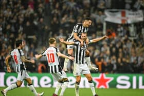 Dan Burn celebrates scoring in the Champions League for Newcastle United.  