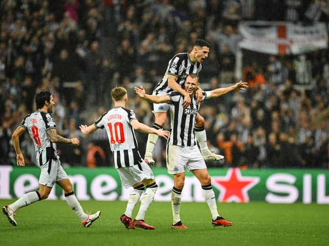 Dan Burn celebrates scoring in the Champions League for Newcastle United.  
