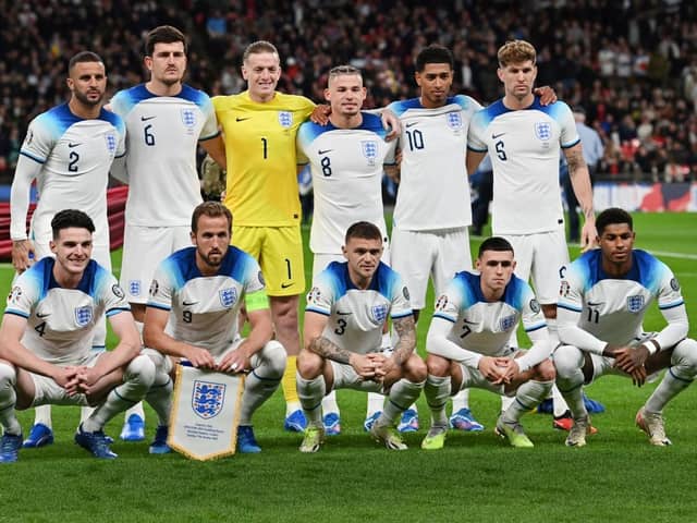 (front row from L to R) England’s midfielder #04 Declan Rice, England’s striker #09 Harry Kane, England’s defender #03 Kieran Trippier, England’s midfielder #07 Phil Foden, England’s striker #11 Marcus Rashford (back row from L to R) England’s defender #02 Kyle Walker, England’s defender #06 Harry Maguire, England’s goalkeeper #01 Jordan Pickford, England’s midfielder #08 Kalvin Phillips, England’s midfielder #10 Jude Bellingham and England’s defender #06 Harry Maguire pose for team photo prior to the Euro 2024 qualifying group C football match between England and Italy at Wembley, in London, on October 17, 2023. (Photo by Glyn KIRK / AFP) 