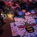 Flowers and balloons are placed in central Manchester on May 22, 2018, the one year anniversary of the deadly attack at Manchester Arena. 