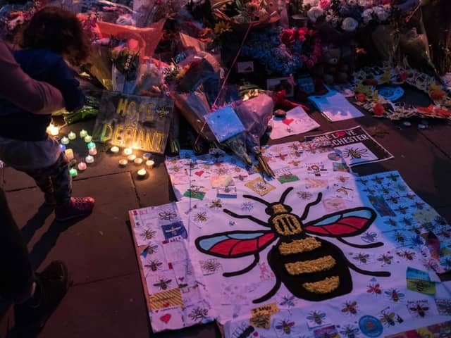 Flowers and balloons are placed in central Manchester on May 22, 2018, the one year anniversary of the deadly attack at Manchester Arena. 