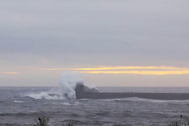 Astonishing pictures shows the moment huge 40ft-high waves destroyed a historic lighthouse as Storm Babet batters Britains coastline. 