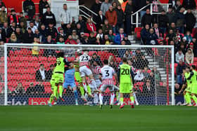 Luke McNally heads Stoke City into a second half lead