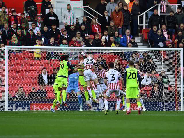 Luke McNally heads Stoke City into a second half lead