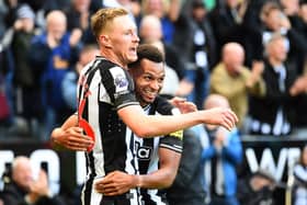 Newcastle United's English midfielder #36 Sean Longstaff (L) celebrates with Newcastle United's English midfielder #23 Jacob Murphy (R) after scoring their third goal during the English Premier League football match between Newcastle United and Crystal Palace at St James' Park in Newcastle-upon-Tyne, north east England on October 21, 2023. (Photo by ANDY BUCHANAN / AFP) 