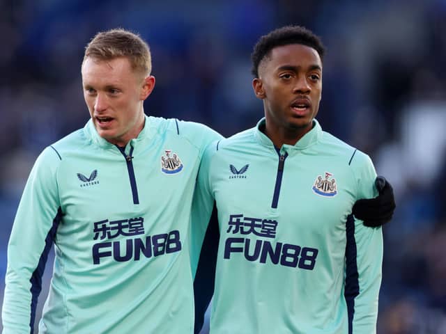 Sean Longstaff and Joe Willock of Newcastle United embrace each other prior to the Premier League match between Leicester City and Newcastle United at The King Power Stadium on December 26, 2022 in Leicester, England. (Photo by Nathan Stirk/Getty Images)