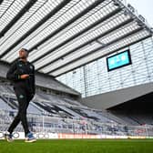 Joe Willock of Newcastle United inspects the pitch prior to the UEFA Champions League match between Newcastle United FC and Borussia Dortmund at St. James Park on October 25, 2023 in Newcastle upon Tyne, England. (Photo by Michael Regan/Getty Images)