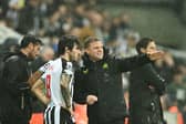 Newcastle United's Italian midfielder #08 Sandro Tonali (L) speaks with Newcastle United's English head coach Eddie Howe prior to enter the pitch during the UEFA Champions League Group F football match between Newcastle United and Borussia Dortmund at St James' Park in Newcastle-upon-Tyne, north east England, on October 25, 2023. (Photo by Oli SCARFF / AFP)