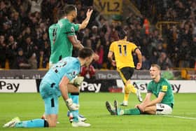  Dan Burn of Newcastle United looks dejected after Hwang Hee-Chan of Wolverhampton Wanderers scores the teams second goal during the Premier League match between Wolverhampton Wanderers and Newcastle United at Molineux on October 28, 2023 in Wolverhampton, England. (Photo by Matt McNulty/Getty Images)