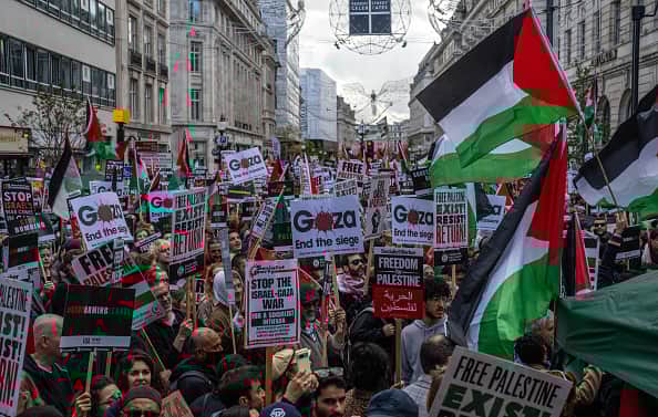 People take part in a demonstration in support of Palestine on October 14, 2023 in London, United Kingdom.