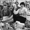 Margaret Raine did the three minute trolley dash round Hinton's store for her father George Elsy, centre, when his ticket came up in a draw held by the Lions Club. Remember it? Photo: Shields Gazette