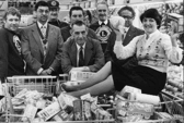 Margaret Raine did the three minute trolley dash round Hinton's store for her father George Elsy, centre, when his ticket came up in a draw held by the Lions Club. Remember it? Photo: Shields Gazette