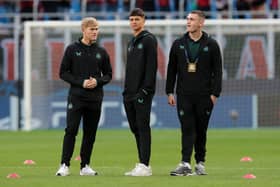  Lewis Hall (L), Lewis Miley (C) and Aidan Harris (R) of Newcastle United inspect the pitch prior to the UEFA Champions League Group F match between AC Milan and Newcastle United FC at Stadio Giuseppe Meazza on September 19, 2023 in Milan, Italy. (Photo by Emilio Andreoli/Getty Images)