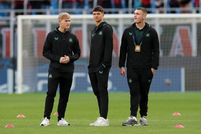 Lewis Hall (L), Lewis Miley (C) and Aidan Harris (R) of Newcastle United inspect the pitch prior to the UEFA Champions League Group F match between AC Milan and Newcastle United FC at Stadio Giuseppe Meazza on September 19, 2023 in Milan, Italy. (Photo by Emilio Andreoli/Getty Images)