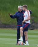 Luke Shaw and opposition coach Marcel Bout of Manchester United in action during a training session ahead of the FA Cup Final match between Crystal Palace and Manchester United at Aon Training Complex on May 19, 2016 in Manchester, England.  (Photo by Matthew Peters/Manchester United via Getty Images)