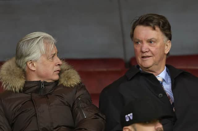 Opposition scout Marcel Bout and  Manager Louis van Gaal of Manchester United watch from the stand during the U21 Premier League match between Manchester United U21s and Norwich City U21s at Old Trafford on February 8, 2016 in Manchester, England.  (Photo by John Peters/Manchester United via Getty Images)