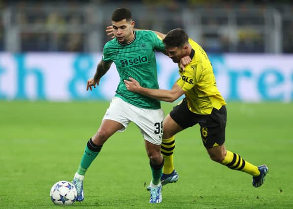 Bruno Guimaraes of Newcastle United is challenged by Salih Ozcan of Borussia Dortmund during the UEFA Champions League match between Borussia Dortmund and Newcastle United at Signal Iduna Park on November 07, 2023 in Dortmund, Germany. (Photo by Lars Baron/Getty Images)