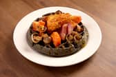 Black pudding and bacon batter, hash browns, tomatoes, mushrooms, with bacon and orange marmalade drizzle. Hampton by Hilton is trailaling limited edition British Breakfast Waffle Trio as part of its free hot breakfast included in every stay