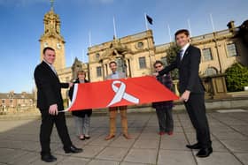 Chief Executive Jonathan Tew, Leader Cllr Tracey Dixon, Director of Public Health, Tom Hall, Cllr Ruth Berkley and Cllr Adam Ellison are pictured with the White Ribbon flag.