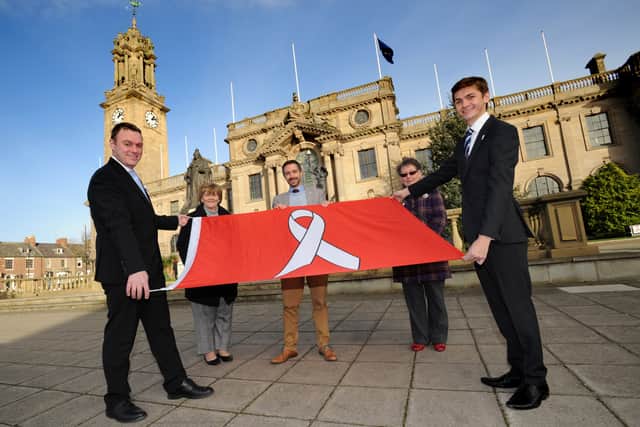 Chief Executive Jonathan Tew, Leader Cllr Tracey Dixon, Director of Public Health, Tom Hall, Cllr Ruth Berkley and Cllr Adam Ellison are pictured with the White Ribbon flag.