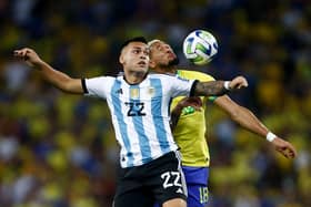 Lautaro Martinez of Argentina jumps for the ball against Joelinton of Brazil during a FIFA World Cup 2026 Qualifier match between Brazil and Argentina at Maracana Stadium on November 21, 2023 in Rio de Janeiro, Brazil. (Photo by Wagner Meier/Getty Images)
