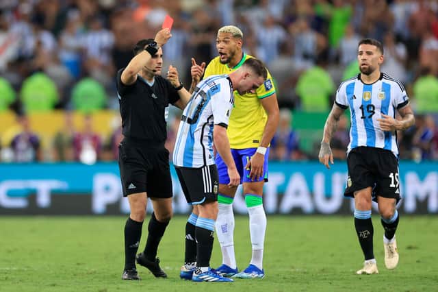 Referee Piero Maza shows a red card to Joelinton of Brazil during a FIFA World Cup 2026 Qualifier match between Brazil and Argentina at Maracana Stadium on November 21, 2023 in Rio de Janeiro, Brazil. (Photo by Buda Mendes/Getty Images)