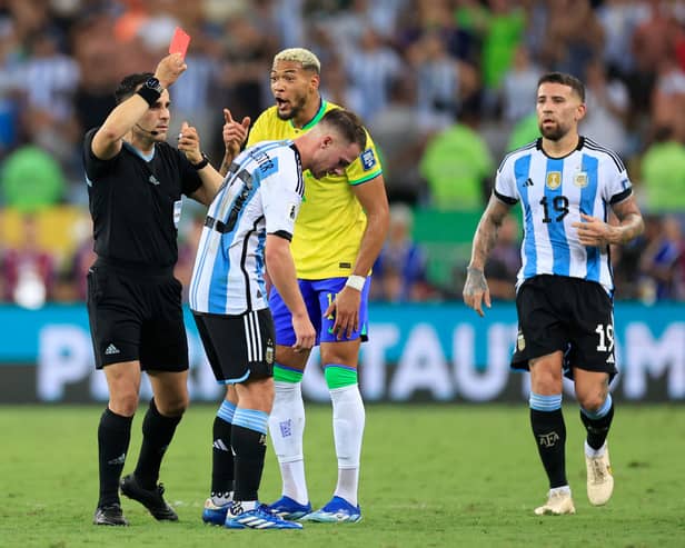 Referee Piero Maza shows a red card to Joelinton of Brazil during a FIFA World Cup 2026 Qualifier match between Brazil and Argentina at Maracana Stadium on November 21, 2023 in Rio de Janeiro, Brazil. (Photo by Buda Mendes/Getty Images)
