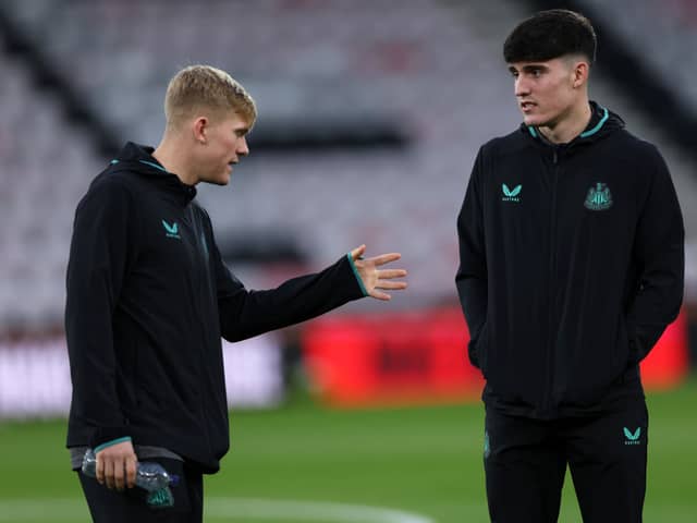 Tino Livramento of Newcastle United (R) speaks with teammate Lewis Hall prior to the Premier League match between AFC Bournemouth and Newcastle United at Vitality Stadium on November 11, 2023 in Bournemouth, England. (Photo by Eddie Keogh/Getty Images)