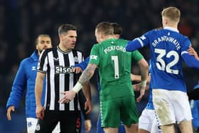 Fabian Schar of Newcastle United and Jordan Pickford of Everton clash following the Premier League match between Everton FC and Newcastle United at Goodison Park on December 07, 2023 in Liverpool, England. (Photo by Clive Brunskill/Getty Images)