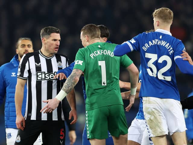 Fabian Schar of Newcastle United and Jordan Pickford of Everton clash following the Premier League match between Everton FC and Newcastle United at Goodison Park on December 07, 2023 in Liverpool, England. (Photo by Clive Brunskill/Getty Images)