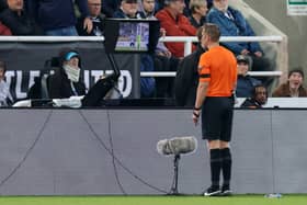 Craig Pawson and VAR in action at St James' Park (Image: Getty Images)